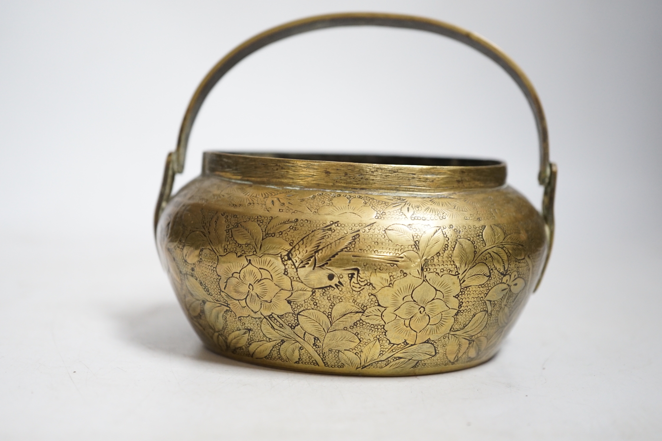 A Chinese bronze hand warmer, 11.3cm and an 18th century Chinese Canton enamel cup, cup 7cm diameter